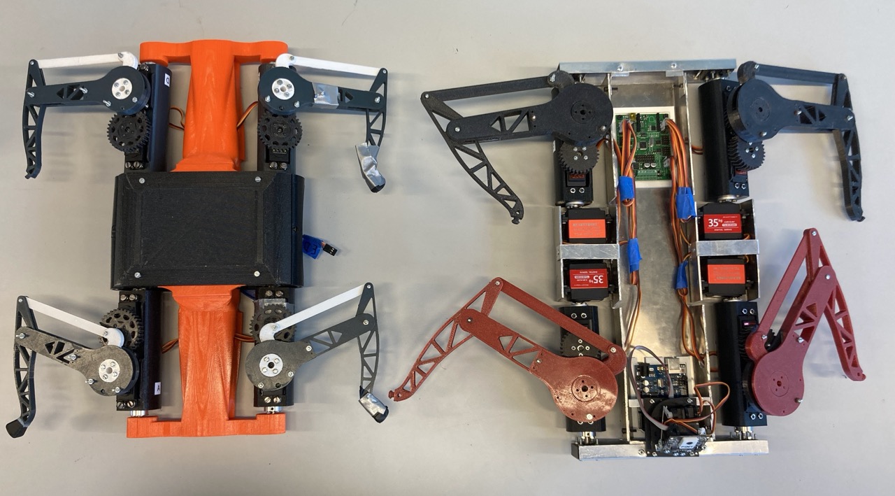 Two robots side by side from above: the older orange and black printed version on the left, the newer aluminium-framed build with red and grey legs on the right.